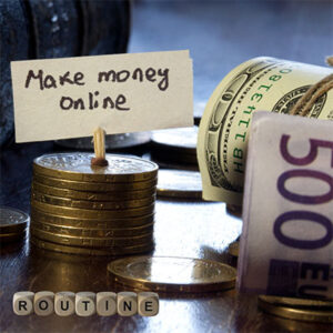 Different forms of currency, bills and coins, laid out on a surface with a small sign that reads, "Make money online" and the word "ROUTINE" spelled out in blocks.