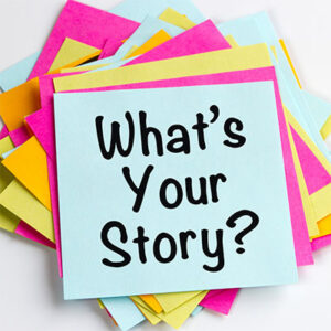 stack of post-it notes with "What's Your Story" written on the top.