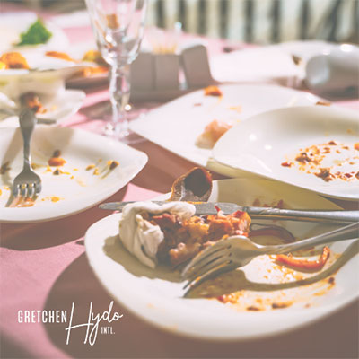 color photograph of plates with food remnants on them after a meal